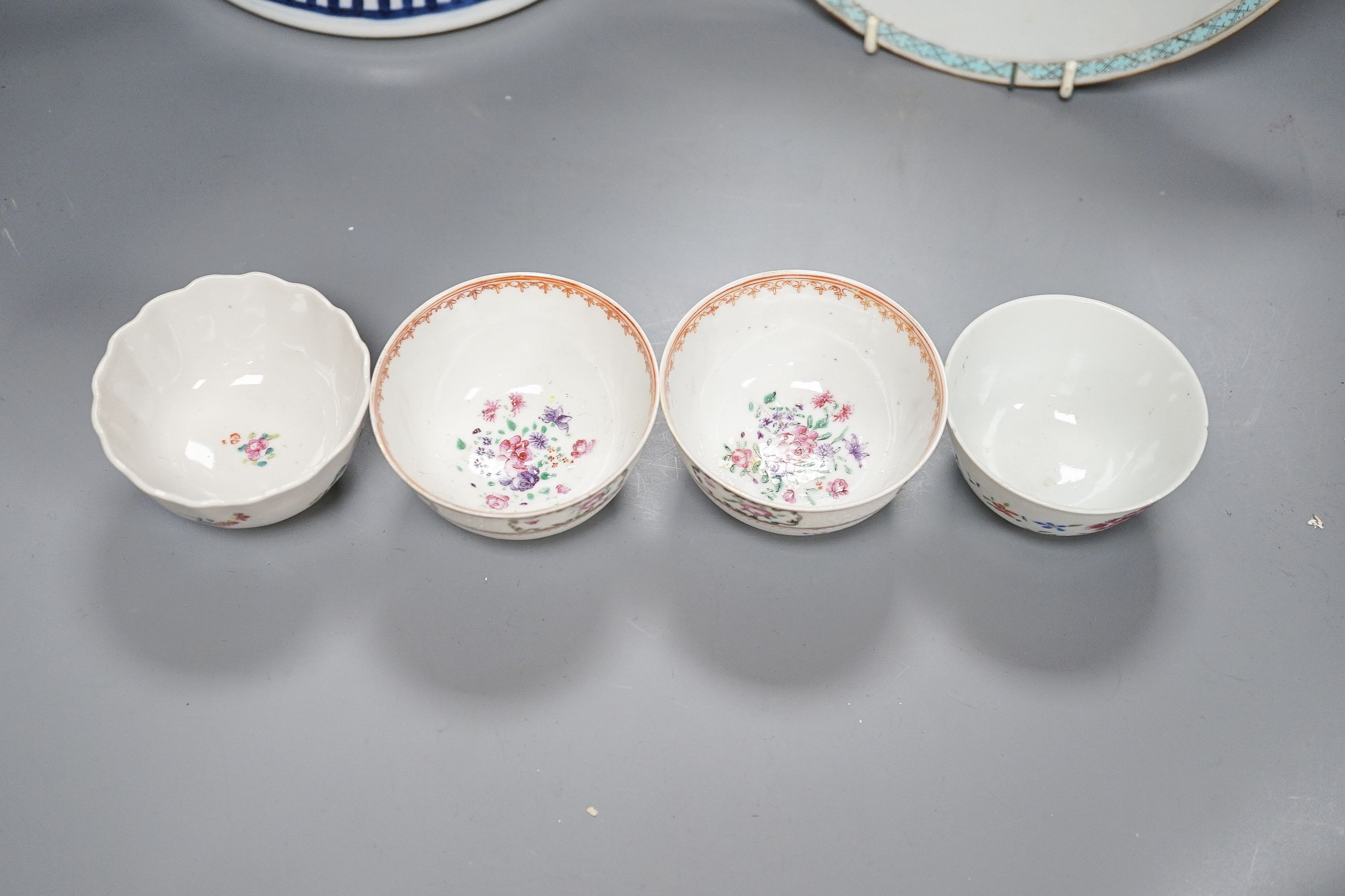 A 19th century Chinese blue and white Prunus jar and cover, 36cm and a group of 18th century Chinese export famille rose tea bowls and a plate